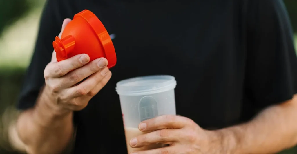 Man holding a shaker cup