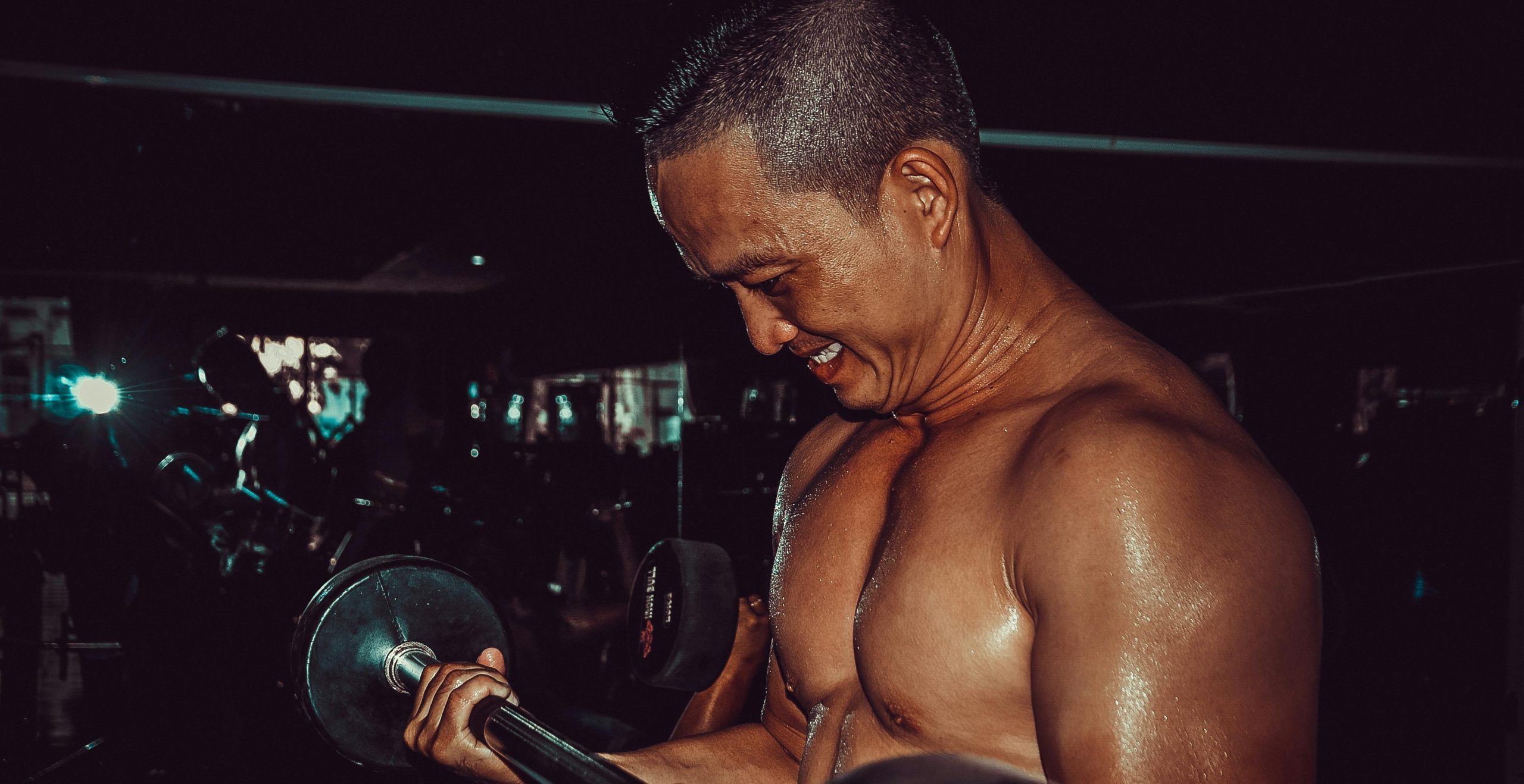 Men training biceps in the gym